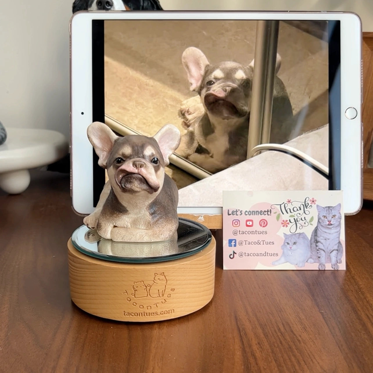 Custom French Bulldog puppy sculpture by TaconTues, placed beside tablet with real dog photo — lifelike handmade pet tribute for dog lovers